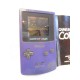 Consola Game Boy color en color morado con instrucciones