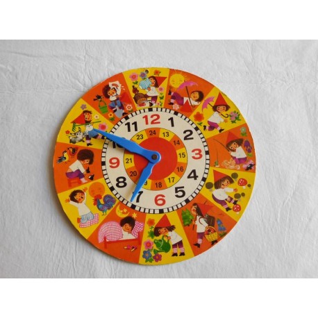 Reloj para aprender las horas con ilustraciones y agujas en plástico. Años 60-70.