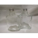 Antiguas botellas de brandy de Domecq tipo petaca con tapón metálico. Años 50.